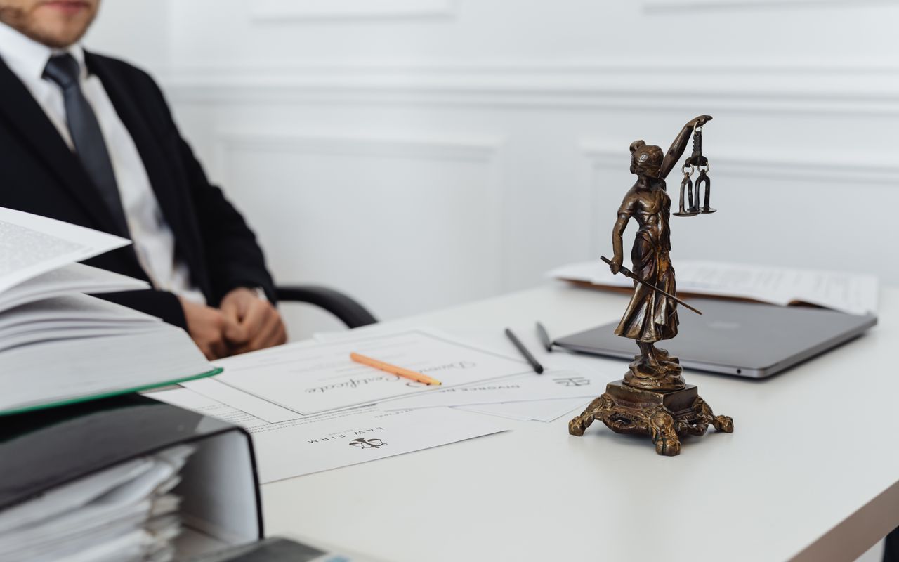 A lawyer working at a desk in a modern office